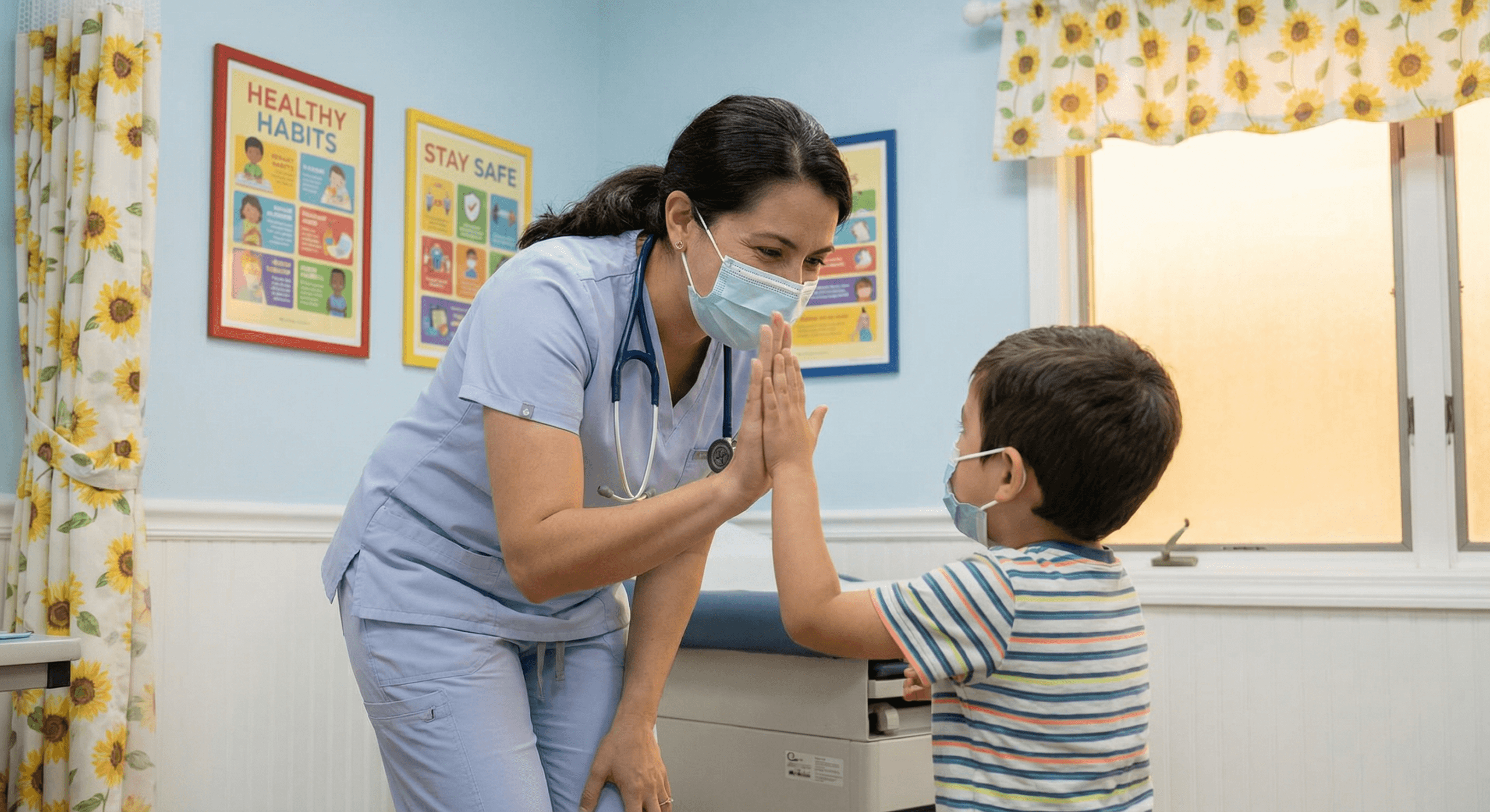A pediatrician offers a warm high‑five to a smiling child in a bright exam room, symbolizing reassurance and preventive care.