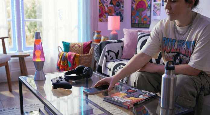 screen-time-detox-realistic-digital-balance.jpg A person sets their phone down beside a cup of tea and a book in soft natural light, portraying calm mindfulness during a screen‑time detox.